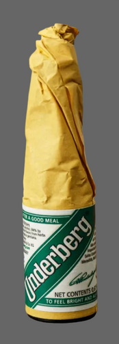 Underberg digestif bottle in brown paper wrapping